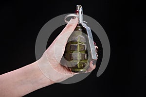 fragmentation grenade in girl hand