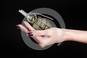 fragmentation grenade in girl hand