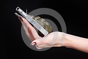 fragmentation grenade in girl hand