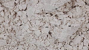Fragmentation of white rock chalk, plaster, putty... photo