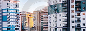 Fragments of facades of modern multi-storey residential buildings, side view. Banner