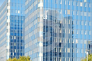 fragments multi-storey office and residential buildings in European city with reflective glass facades, modern high-rise office