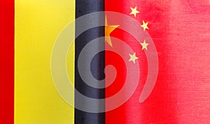 Fragments of national flags of Belgium and China close-up