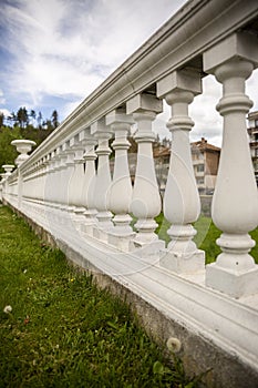 Fragments of white marble stone railings. Bridge guardrail.