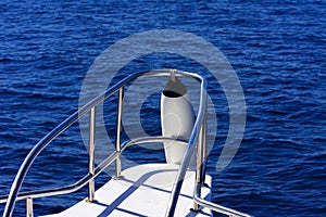 Fragments of a white yacht in the bay of the Red Sea against the blue sky of old high coral reefs