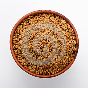 Fragrant grains of fenugreek on a white background