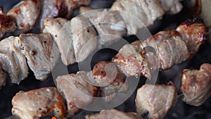 Fragrant kebab is roasted on skewers on the grill rotating