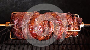 Fragrant mutton leg is roasted on skewers on the gas grill