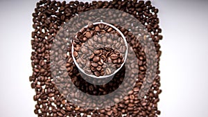 Fragrant roasted coffee beans on a white background,top view.