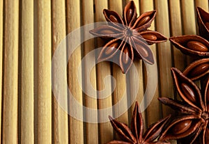 Fragrant spice star anise on a bamboo mat