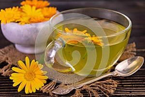 Fragrant tea from calendula flowers. Close-up.