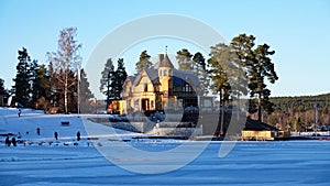 Framby Udde point at Frozen Runn lake near Falun in Sweden photo