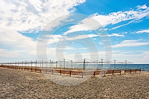 Frame of beach umbrellas on a deserted sea beach