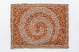 Frame of burlap and buckwheat grain