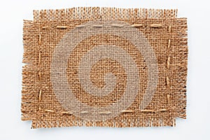 Frame of burlap, lies on a background of burlap with place for