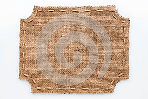 Frame of burlap, lies on a white background
