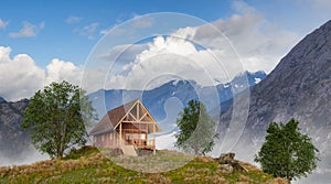 A-frame Cabin home on top of a mountain with beautiful view on rugged peaks