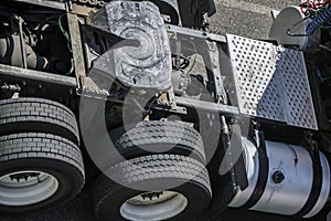 Frame and chassis of a big rig semi truck tractor with double wheels and a fifth wheel with a hitch in lubrication