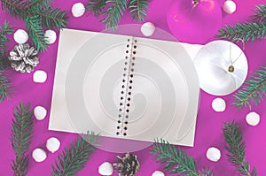 Frame of Christmas decoration on purple background top view