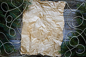 Frame of Christmas tree branches around Paper