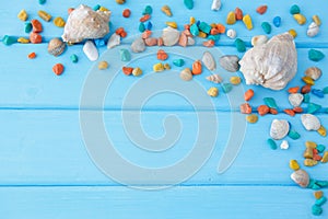 Frame of colorful stones with a large seashell