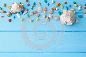 Frame of colorful stones with a two seashell