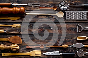 Frame of cookware for chef work on wooden background top view space for text