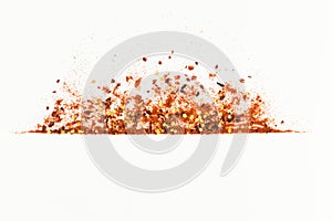 Frame of crushed red cayenne pepper, red paper paprica, dried chili flakes and seeds isolated on a white background. Homemade