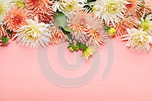 Frame of dahlia flowers, abstract floral arrangement, spring or autumn background with place for text, minimal holiday concept,