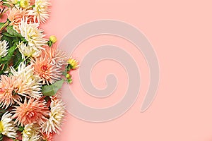 Frame of dahlia flowers, abstract floral arrangement, spring or autumn background with place for text, minimal holiday concept,