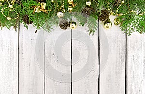 Frame from decorated Christmas tree on white rustic wooden background with copy space for text. Happy New Year concept. Holiday b