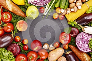 Frame of different food products on a dark surface