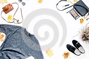 Frame of dress, sunglasses, sneakers, bag with cosmetics. autumn