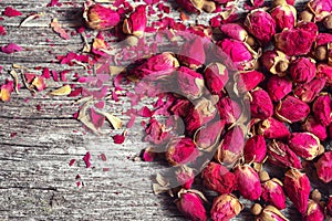 Frame with dried rose petals and buds