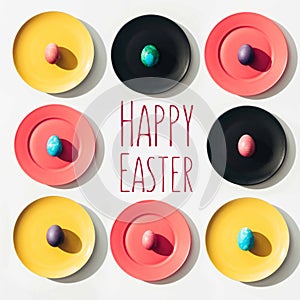 frame of easter eggs on colorful plates with happy