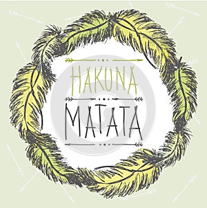 Frame of feathers and an inscription- hakuna matata