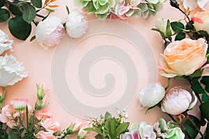 Frame of flowers. Summer blooming delicate peonies and roses, festive background, pastel and soft bouquet, mock up greeting card.