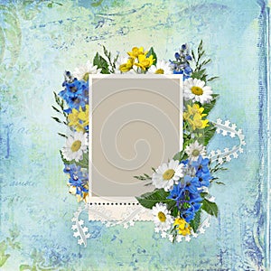 Frame with flowers on a vintage background