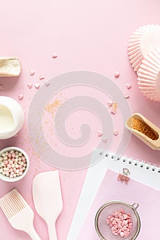 Frame of food ingredients for baking on a gently pink pastel background. Cooking flat lay with copy space. Top view. Baking