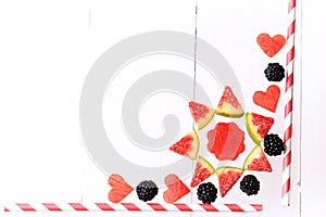 Frame from fresh fruits and berries. watermelon, figs, blackberries