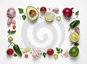 Frame of fresh guacamole ingredients on white background, flat lay. Space for text
