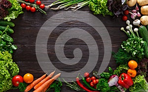 Frame of fresh vegetables on wooden background with copy space