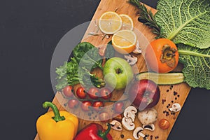 Frame of fresh vegetables on wooden background with copy space