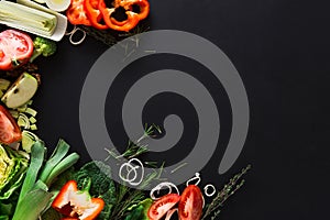 Frame of fresh vegetables on wooden background with copy space