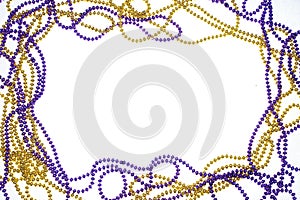 A frame of gold and purple beads photo