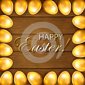 Frame from golden Easter eggs on wooden background