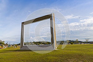 frame in the Golden Jubilee Crown Park in Bandar Seri Begawan, Brunei. green grass field and blue sky in background