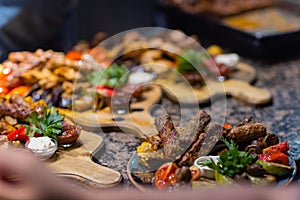 Frame of grilled steak, grilled vegetables, potatoes, salad, different snacks and homemade lemonade, top view. Concept