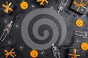 Frame from Halloween holiday decorations  and gifts on black background