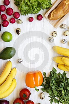 Frame of health food on a white wooden table. Healthy eating. Top view. From above. Flat lay, overhead